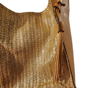Shiny gold hand bag with tan leather accents